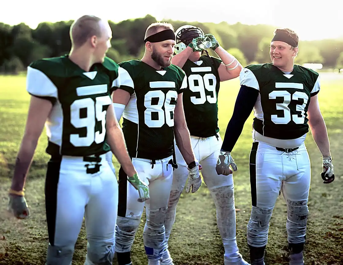 A group of adult men on a football team.