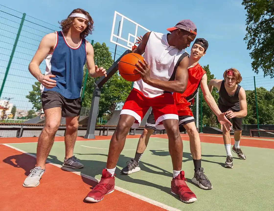 A group of adult men on a basketball team.