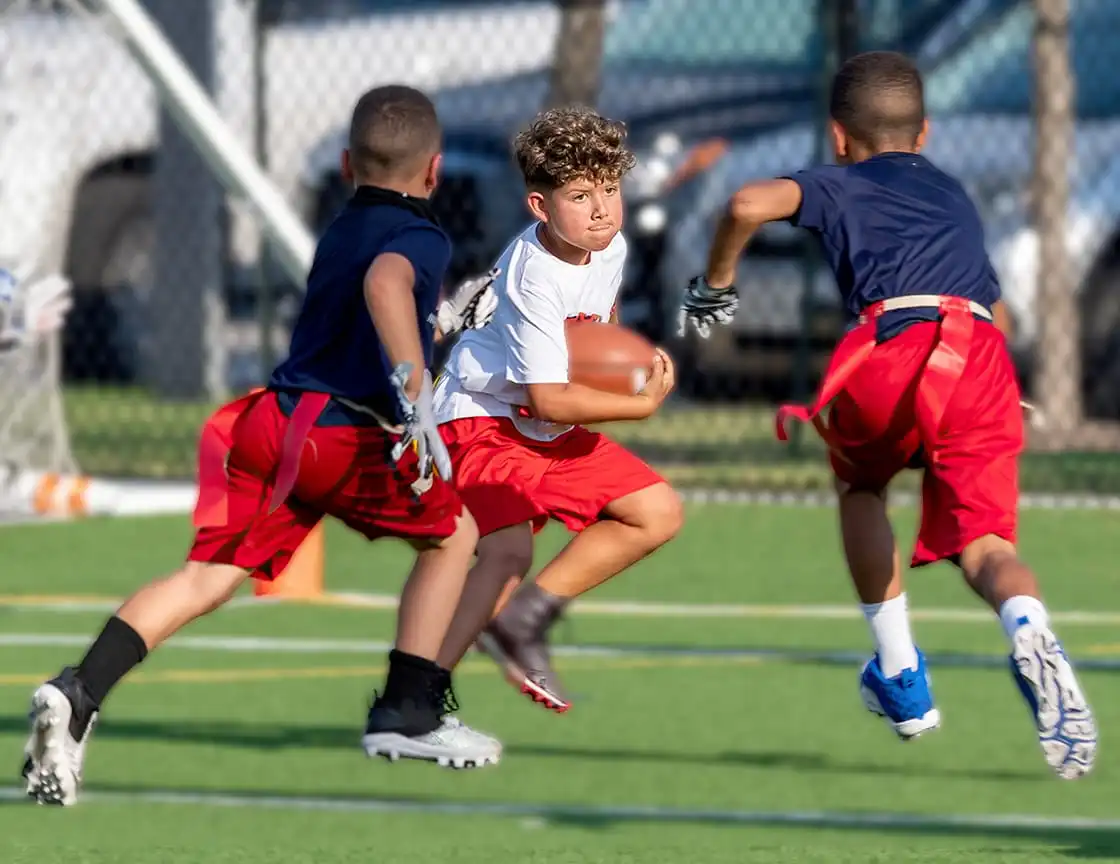 A group of children playing on a flag football team.